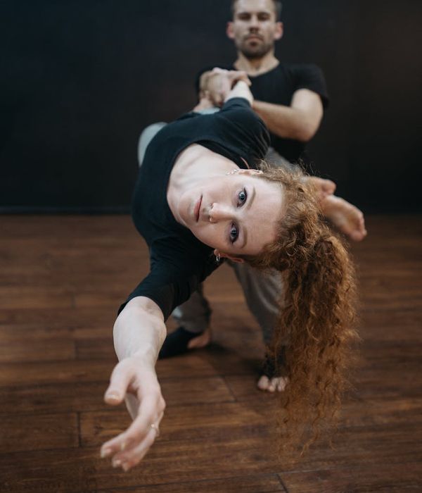 Man in a controlled athletic pose, showing focus and strength.